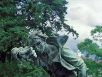 Detail of the National Monument of Costa Rica showing a bronze figure of William Walker lunging forward with a rifle.
