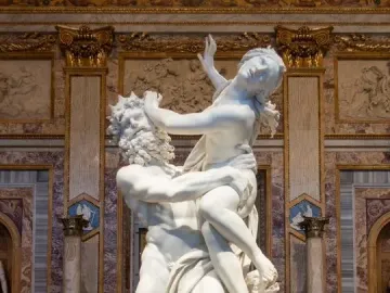 Bernini\'s Rape of Proserpina marble sculpture showing Pluto carrying a struggling Proserpina beside Cerberus