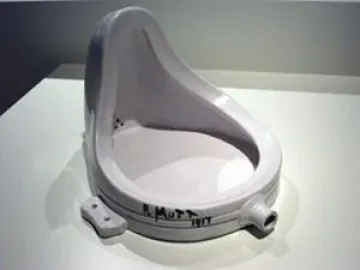 An inverted white porcelain urinal signed R. Mutt 1917 near the base.