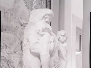 Palestrina Pietà marble sculpture with three intertwined figures, showing rough unfinished surfaces and chisel marks.