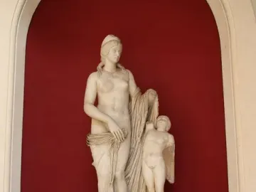 Venus Felix marble statue with a draped female figure and a small winged child figure beside her.