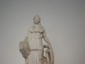 Lenormant Athena marble statuette of a draped female figure holding a shield-like object.