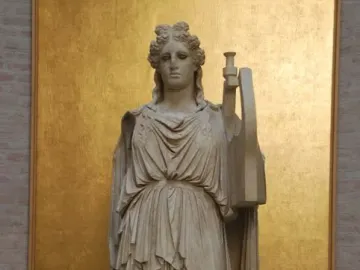 Apollo Barberini marble statue standing in a flowing robe and holding a lyre