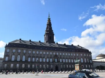 Frederick VII equestrian monument on a stone pedestal in front of Christiansborg Palace in Copenhagen.