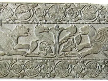 Plutei of Theodota carved stone relief with winged lion-like creatures flanking a central plant motif and surrounded by ornate decorative borders.