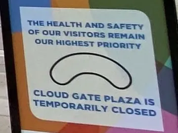 Sign announcing Cloud Gate Plaza is temporarily closed, with a simple outline of the sculpture.