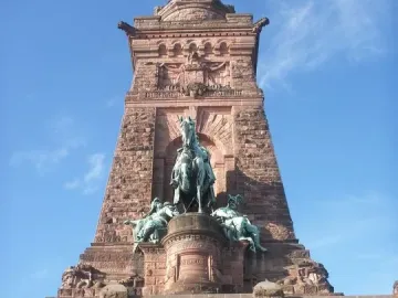 Kyffhäuser Monument with a large equestrian statue above a carved stone arch and seated bearded figure.