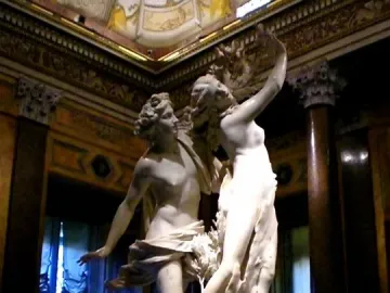 Bernini’s Apollo and Daphne marble sculpture showing Apollo lunging toward Daphne as she transforms into a tree.