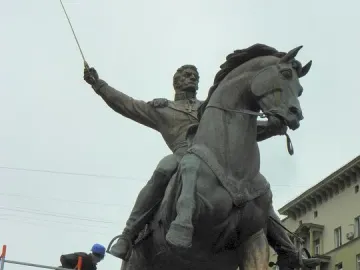 Pyotr Bagration Monument with workers maintaining the bronze equestrian statue on its stone pedestal