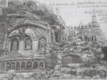 Rothéneuf Sculpted Rocks with a carved tomb-like structure and densely sculpted faces in the surrounding rock