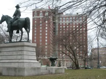 Ambrose Burnside Monument, a bronze equestrian statue on a stone pedestal in an urban park.
