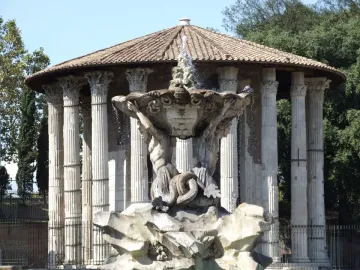 Fountain of the Tritons with a shell-like basin supported by two muscular figures, in front of an ancient circular temple in Rome.