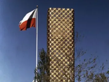 King Jagiello Monument beside a tall gold-toned pavilion with a Polish flag in front of it