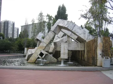 Vaillancourt Fountain with rough concrete forms and flowing water in an urban plaza.