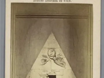 Cenotaph of Archduchess Maria Christina, a pyramidal marble monument with sculpted figures and a winged figure above a dark entrance.