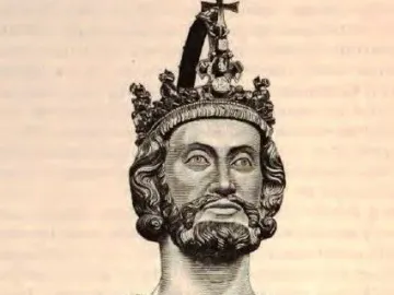 Bust of Charlemagne showing a bearded man with long wavy hair, a crown with a cross, and a decorated chest piece.