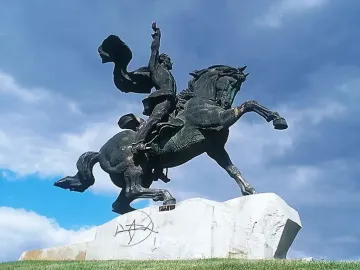 Suvorov Monument depicting a bronze equestrian statue of a man on a rearing horse with one arm raised.