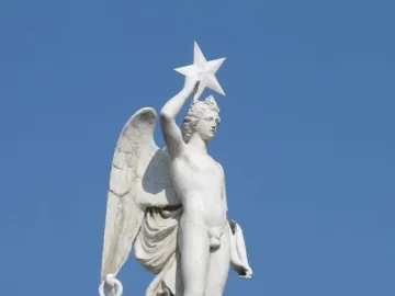 Winged marble statue of the Genio Catalán holding a star above its head