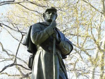 Seventh Regiment Memorial showing a uniformed soldier holding a rifle upright.