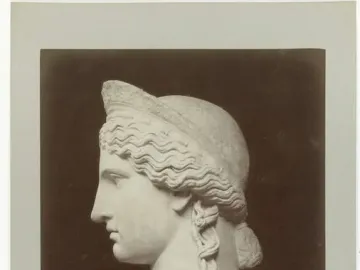 Juno Ludovisi marble bust in profile facing left, with wavy hair and a decorative band.