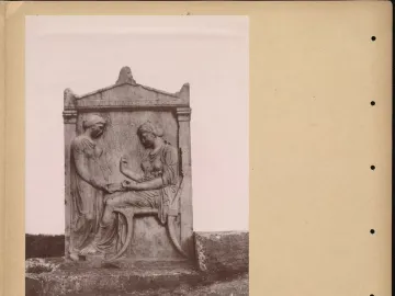 Grave Stele of Hegeso showing two draped women, one seated and examining an object while another stands beside her with an open box.