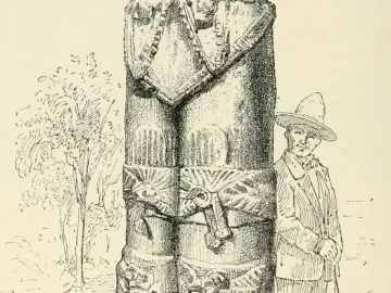 Atlantean Figures at Tula, a carved stone warrior figure shown beside a man for scale.