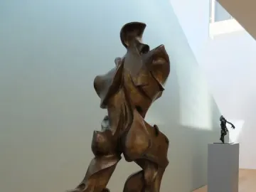 Unique Forms of Continuity in Space bronze sculpture of a striding human figure