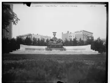 The Great God Pan fountain with a dark bronze figure at the center of a curved stone basin.