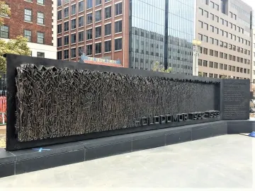 Holodomor Memorial bronze relief with wheat stalks and the inscription 1932-1933