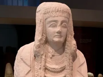 Lady of Cerro de los Santos statue holding a small vessel at chest level