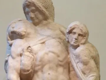 Palestrina Pietà, a partially carved marble sculpture of three figures with a central draped body supported by two others.