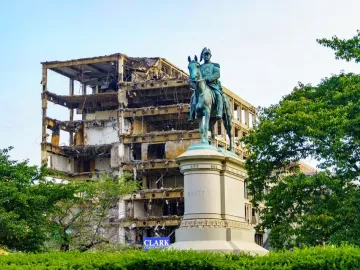 Winfield Scott equestrian statue in front of a partially demolished building.