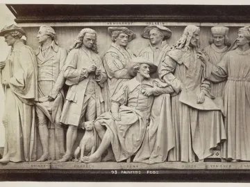 Section of the Frieze of Parnassus on the Albert Memorial showing several sculpted painters and a small dog.