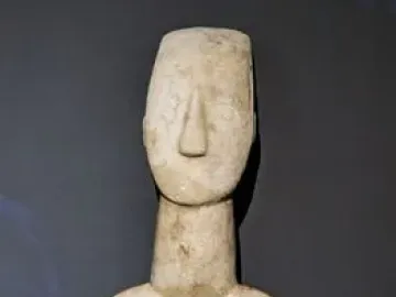 Kykladic Idol marble female figurine with folded arms and elongated head