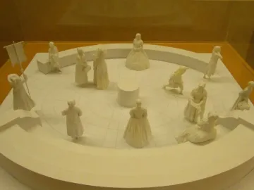 Virginia Women\'s Monument model showing miniature female figures arranged around a circular platform with a central column.