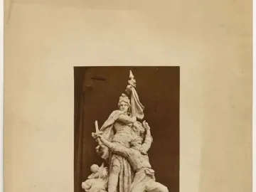 Sepia photograph of the La Défense de Paris sculpture group, showing a draped female figure standing over a kneeling soldier.