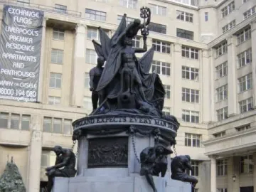 Nelson\'s Monument at Exchange Flags, showing a bronze figure group on a stone base with chained figures around the lower level.
