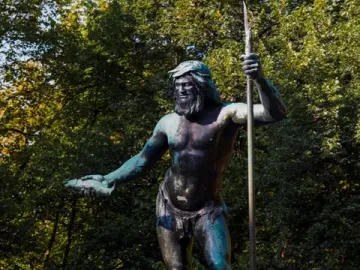 Rhine Water Fountain bronze statue of a bearded man holding a spear and fish beside a pedestal inscribed Argentorato
