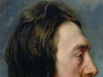 Profile portrait of King Charles I with long dark wavy hair, a pointed goatee, and a white collar.