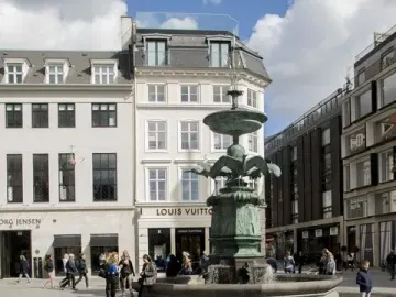 Stork Fountain with green-patinaed bird figures in a Copenhagen city square