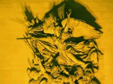La Marseillaise stone relief on the Arc de Triomphe, showing a winged figure above armed figures in dramatic movement.