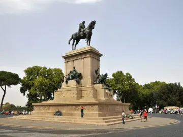 Giuseppe Garibaldi equestrian statue on a large stone pedestal in a public square