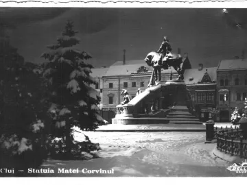 Matthias Corvinus Monument showing an equestrian statue with smaller figures at the base in a snowy setting.