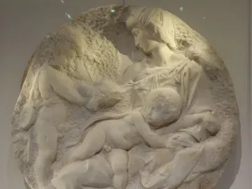 Taddei Tondo marble relief showing the Virgin and two children