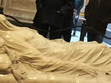 The Veiled Christ marble sculpture showing a reclining figure covered by a finely carved translucent-looking veil.