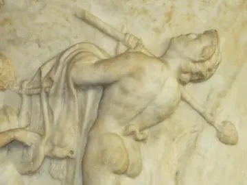 Borghese Vase relief showing a nude dancing satyr with a staff, beside a lyre player and a small crouching creature.