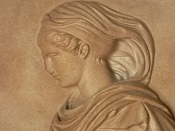 Gradiva relief showing a woman\'s head and upper torso in profile, looking downward.