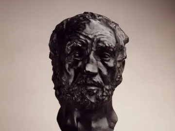 Bust of Man with the Broken Nose showing an older bearded man with a flattened nose on a dark pedestal.