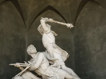 Winkelried Memorial marble sculpture showing two male figures in a dramatic struggle, one poised to strike a prone figure holding arrows.
