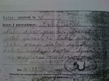 A close-up of an aged handwritten letter with printed lines and a circular 1943 stamp.